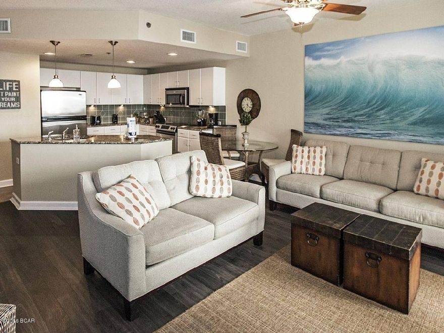 JUST REDUCED $3000 ***** Grand Panama Beach Resort is one of the most desired Resorts on the Beach. This 1 bed 2 bath with bunk condo has all the upgrades. Tile, granite counter tops, Tile hardwood in family room, and a great view of our beautiful Gulf of Mexico. This unit is a rental machine and always in demand. Resort has 2 pools, tiki bars, fitness facility, conference center, Both towers have been recently painted look brand new.It is priced for a quick sale a must see!!