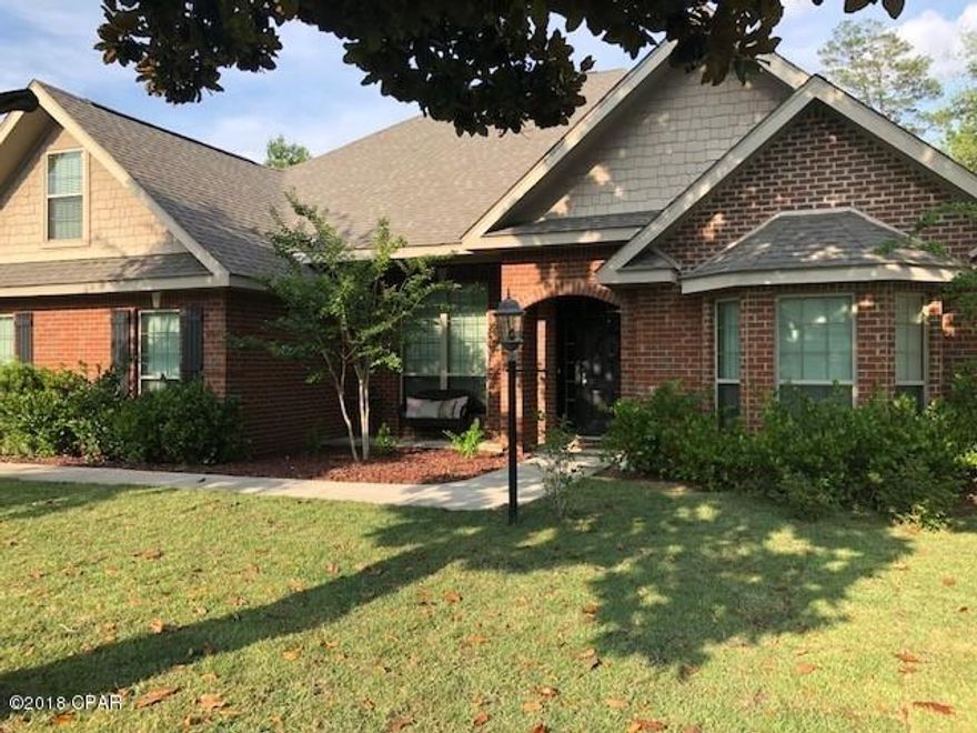 Beautiful well kept home located in gated community. Open spacious living area to entertain. Beautiful step up tray ceilings, crown moulding, engineered wood flooring in formal dining room . Large Kitchen  and open to family room with granite countertops, stainless appliances, tile flooring. Master bedroom has a perfect sitting area for a office space or if needed for a baby nursery or just a place to relax with a book. Other 3 bedrooms are nice size. This home also has a formal living room that would make a nice office if needed. The 4th bedroom is upstairs . This is a lake front community with private owner access to the beautiful lake for swimming, fishing, kayaking. Privacy fenced back yard. Age, SF Lot and room sizes are approximate. Please verify if important