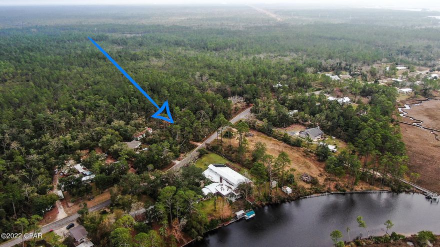 A rare opportunity to own land in this unique, secluded fisherman's paradise. Build your dream home or move your mobile home onto this large, ½ acre plus, wooded property. If you like fishing, boating and kayaking, this is the place. Less than a mile away from a public boat ramp that will take you to West Bay and the Gulf of Mexico. Only minutes from the Florida International Airport, less than 25 minutes to the sandy beaches of Panama City Beach, Pier Park or shopping in Lynn Haven. Please contact me for more information.