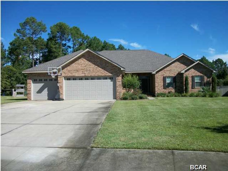 Space! Space! Space! This beautiful like new 2010 custom built 2,964 square foot home has all you need. Sitting on .64 acre lot in The Landings subdivision in Lynn Haven. This home has 4 or 5 bedrooms and 3 baths to go along with 2 other ''flex space'' rooms. The 5th bedroom can be a play room or bonus area. There is also a den that can be used as an office. In addition to the already spacious 2 car garage this home has a huge 336 square foot boat garage. The back yard is huge with a garden area in the back with separate reclaimed water line. The flow of the home is excellent with privacy and play areas away from the living area. The open floor plan and double ovens make this home great for entertaining. It has a beautiful kitchen with Granite counter tops. The home has raised ceilings