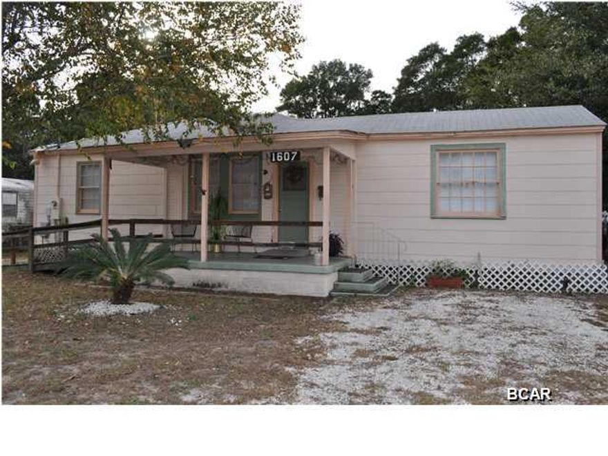 Just one block from the bay and Lake Huntington is where you'll find this charming St. Andrews home. This home has hardwood flooring in most rooms and a spacious kitchen and dining area. The backyard is partially fenced and includes a storage shed, and there is a handicap ramp that leads to the front porch. The location is superb; not only are you close to the water, you're also just 5 minutes from the main street in St. Andrews and downtown Panama City. All info is approx. and must be verified by Buyers if important.