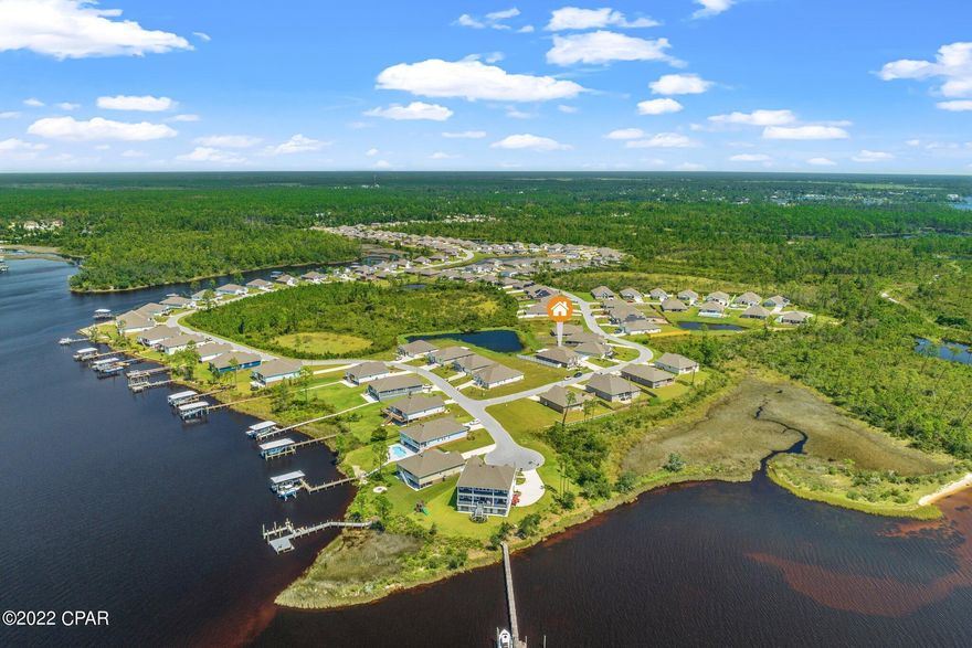 CURRENTLY UNDER CONTRACT, SELLER WILL CONSIDER BACKUP OFFERS Newly constructed McKenzie floorplan with 5 bedrooms and 3-bathrooms is 3,086 SQFT. This home is located in the community of Fanning Bayou and sits across the street from the bay with beautiful water views. This master planned community features a resort like community pool with a spa, gas grills, playground and plenty of seating. This amenity is perfect for get together and parties for all ages. The outside features of this home are the 3-car wide driveway, Parking pad beyond the RV gate for boats, trailers or utility vehicles, expansive covered and screened rear porch measuring 30x30 with coated epoxy flooring. As you enter the home you will find an open and welcoming foyer, a bonus room to the left of the front entry that could be used as a bedroom or flex room a large well-lit formal dining room, tray ceilings, ample storage with a large walk-in pantry, vinyl plank flooring, 10-foot ceilings and bull nose corners throughout. The main living space is an open concept with luxury plank vinyl flooring, perfect for a large family or entertaining. In the kitchen you will find a beautiful island with ample cabinets, counter space, seating and Kinetico water filtration system. This home also has a breakfast nook for extra seating!! The living room has tons of natural lighting and a modern color, this floor plan offers 2 standard sized bedrooms, and two oversized bedrooms. The master suite features a walk-in closet, double vanity, garden tub, and separate shower. Some additional features of this home include the backyard that backs up to a gorgeous community lake where you will regularly see turtles and birds. With this home you will also have the standard smart home technology package including- touch panel, keyless entry, and the option to add additional devices. This community is located just minutes from the international airport, 25 minutes to Panama City Beach and Pier Park, 45 minutes to Tyndall AFB and the NSA, Naval base.