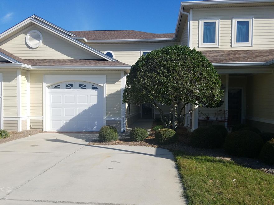 Upscale gated townhouse community close to beaches, 23rd St. and St Andrews. This three bedroom townhome has arched foyer entry with tiled floors crown molding throughout the first floor and a tray ceiling in the living room. The kitchen is both elegant and practical with beautiful wood cabinetry, granite and Corian counters and tiled floors. Master bedroom is on first floor with small sitting area with a patio door overlooking the back patio and lake. The master bath has two large closets, jetted tub, a separate bright tiled walk in shower and two vanities. Upstairs family room and two bedrooms with bath for separate living. One car garage, large inside laundry room, half a bath, lots of storage. View of the lake.Lawncare included.