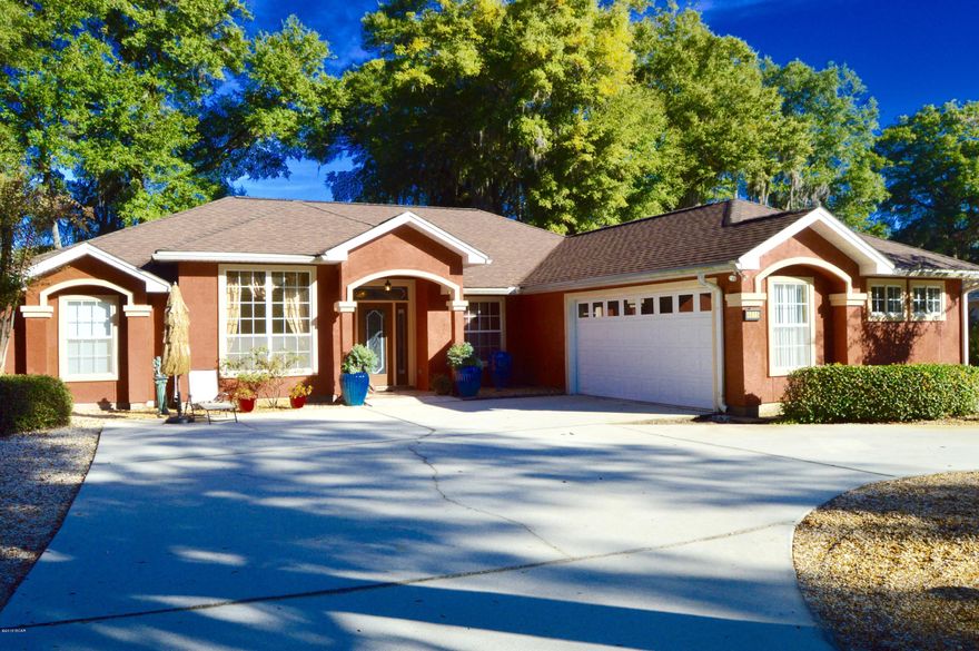 Gorgeous, roomy 4 bedroom, 3 bath home, near Tyndall AFB, well manicured landscaping on a large lot with a circular driveway. This home includes large master suite with oversized en suite including; jetted garden tub, walk in shower, his-hers vanity and closets. Living room showcases beautiful hardwood flooring throughout with a gas fireplace and wired sound system for entertainment. Kitchen features tile flooring, stainless steel appliances, and eat in breakfast area. Home includes formal dining room, large laundry and storage area. This split floor plan brags with a second master suite and two additional bedrooms. The luscious backyard includes a 10x22 screened in porch with a natural gas hookup for a grill, and is a great entertaining space for family and friends.