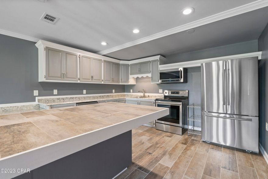 /*/*/  4,500 Sq Ft on 3.46 Acres /*/*/  
 ----> The late 90's country classic 'WIDE OPEN SPACES' must have been made just for this house right here! This property is the one with all the space!---->  Just 11 miles East of Panama City, this newly renovated home is only 15 minutes away from the Worlds Most Beautiful Beaches! It is also just minutes from some of the area's best shopping, dining and family entertainment. 

INTERIOR FEATURES of the home include: fully livable basement area that has endless possibilities. From an imaginable GAME ROOM for the kiddos, a stunning MOTHER-IN-LAW living quarters or the coolest ENTERTAINING AREA for game-days or family events, this area is the spot to be in this home! It has a full kitchen and bathroom and is the statement piece of this home.-----> The upstairs MAIN LIVING AREA boasts tons of wide open spaces throughout all rooms of the house. It has french doors upon entering, new LVP flooring throughout 

EXTERIOR FEATURES of the home include: 
3.46 acres of open space, 2 car garage, balcony access for all 3 bedrooms in upstairs living area with 2 spiral staircase access points to the back yard, roof replaced Nov. 2018 AFTER Hurricane Michael. 

Also, this home JUST REDUCED by $150,000 so jump on this one fast!!

BONUS: this home is located less than 1 mile from 2 of the areas top sports and family outdoor attractions! ----> 1: H.G. Harders Park is one of the areas premiere sports complexes. Youth and Adult Sports such as softball, baseball, soccer flag football and more are going on daily at this mega family sports complex. ----> 2: Majette Park is the ultimate family spot. It is home to 'The MONSTER at Majette' a premiere disc golf course that hosts some of the top talent in the nation at tournaments year round while adding family friendly setups as well for players of all ages and abilities. There is also Fishing areas, walking and jogging tracks and even a cricket field. It is a true gem right around the corner from you! 

All sizes are approximate and should be measured by buyer if deemed necessary.