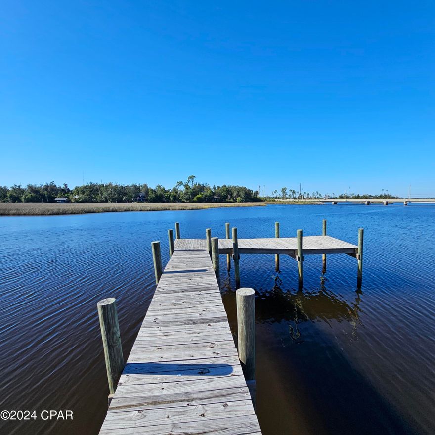 Beautiful Waterfront on Cook Bayou. At over half an acre, there is plenty of space to build your dream home! Just a short boat ride to East Bay and the Gulf of Mexico. Already a dock in place with good water depths. There is one lower bridge to go under in route to the bay but it has around 8ft of clearance, depending on the tides. The front half of the lot is not in a flood zone and has plenty of space for your home. No HOA. Just a few 100 yards to a full-service marina with fuel, ice and bait. The lot is bigger than what you see bushogged. Dont miss this opportunity to be on the water under 100k.