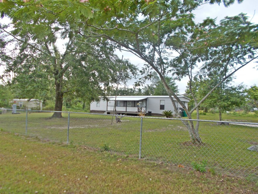 Nicely remodeled home just outside of town, very close to Marianna and Grand Ridge, New metal roof in March 2019 new drainfields, new stove,ref,w/d, new carpet and pad in living room and bedrooms new tile in kitchen and hall,  owners will leave some furnishing if the buyer needs them,  this home looks really good and is ready to move into, nice porch on the front, the yard is fenced with a gate at both drive entrances, very easy to show, call agent.