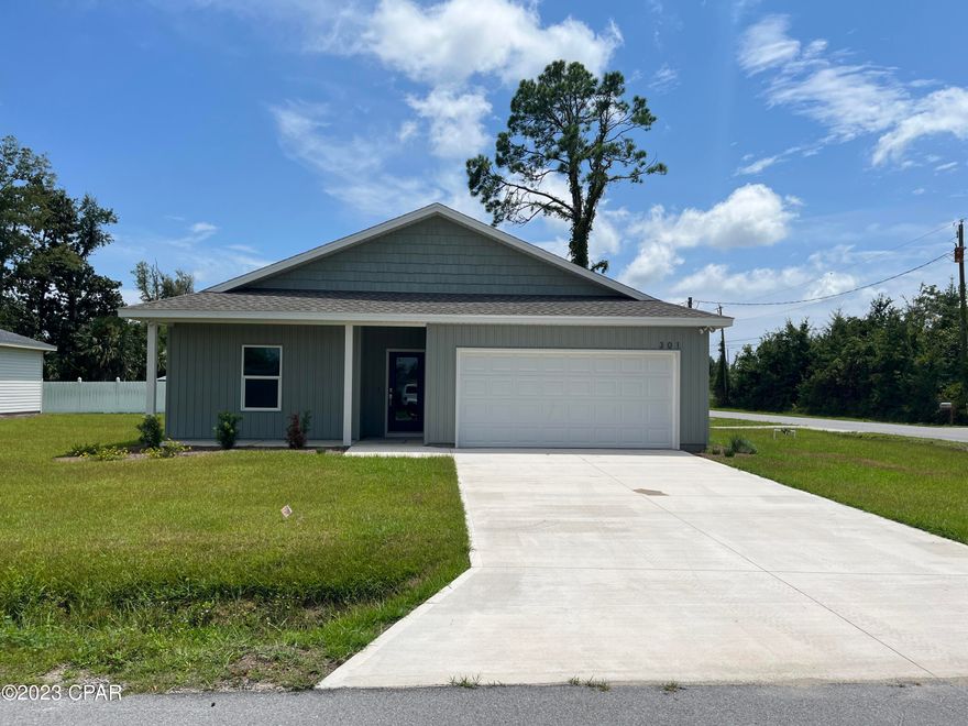 Beautiful corner lot 3-bedroom 2 bath New Construction home in Lynn Haven. This home has a split bedroom floor plan, Open Great Room and kitchen with white shaker style cabinets with beautiful back splash, quartz counter tops. Lots of countertop space with Island bar and sink area that can accommodate seating for 4 stools, nice stainless appliances and large corner pantry. The master bedroom is located off the great room with large walk-in closet. Very convenient location to shopping, grocery stores and restaurants and parks.