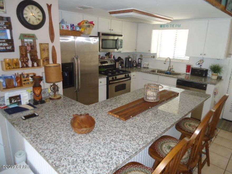 Age, SF, and dimensions approximate. Very nice updated unit. Newer cabinets and granite counters. Vanities done in restrooms. Tiled floors downstairs. Unit located in quiet area of resort. Complex has 11 pools to include clubhouse with pool on the beach. Gated community and pet friendly.