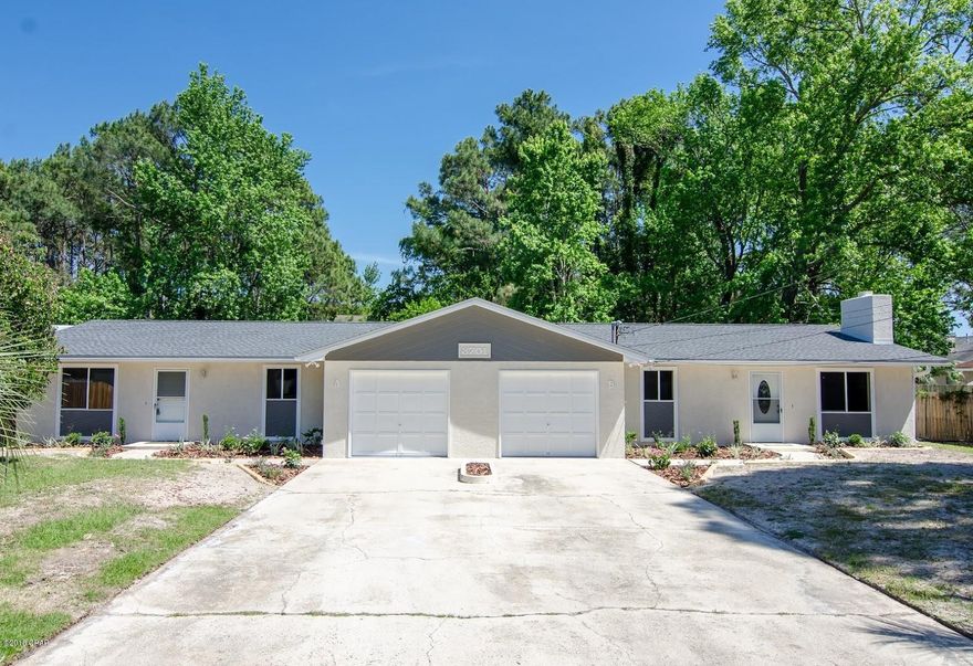 2 UNIT DUPLEX! EACH SIDE HAS 3BR/2BA with over 1,400 sq/ft of living space! NEW ROOF! Live 2.3 miles from the worlds most beautiful beaches! Rent one side and live in the second to cover a portion of the mortgage or rent both sides! This 2,840 sq/ft duplex features new flooring, new tile shower, fresh paint, new countertops in the kitchen, new stainless steel appliances, crown molding, new lighting, new vanities and much more!!

When you enter side A you will be greeted with a large living space that flows seamlessly into the kitchen and dining room. The kitchen showcases new stainless steel appliances, new counter tops, and new tile flooring. As you continue your way down the hall you will find the laundry area, a beautifully renovated spare bathroom and two spare bedrooms.  The... master-bedroom showcases low maintenance title flooring, marble countertops and a beautiful tile shower.
As you enter side B you will notice new flooring, fresh paint, new lighting and a cozy brick wood burning fireplace. The kitchen features an ample amount of counter-space for food prep, new counter tops, new lighting, and new stainless steel appliances. As you continue your journey through the home you will notice an updated spare bathroom, laundry area, two spare-bedrooms and the master-bedroom with a gorgeous master bathroom. You will be impressed with the over-sized yard perfect for summer grill-outs or for the kids to play! All ages, sizes, and specifications are estimated and must be verified.