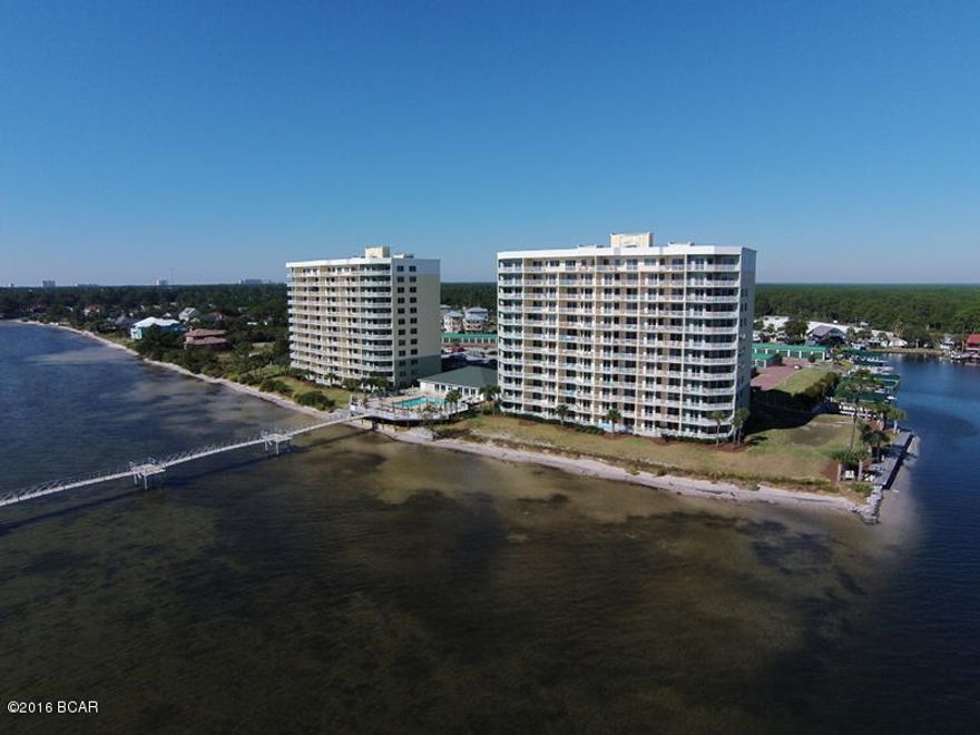 Hibiscus By The Bay is located on St Andrews Bay and the Intracoastal Waterway. A community especially designed for recreational boaters, fisherman and it has its own marina. This is a gorgeous first class waterfront community situated on an elevated 10 acre peninsula with 600 feet of water frontage on beautiful St. Andrews Bay. This is a spacious and bright unit with lots of natural light. This unit features a master bedroom that is waterfront with sliding door access to the spacious balcony, that is approx. 203 sq. ft. There is access to the balcony from the main living area as well. The balcony provides expansive views of St. Andrews Bay to north and east and the Intracoastal Waterway. What a great place to have coffee and watch the sunrise! The community has a pool with outdoor grills, an awesome 500 ft. pier, fitness room with a view, meeting-library room, owner's lounge with a view and a tennis court with a great view.