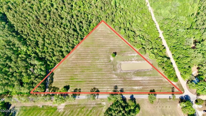 Discover the perfect blend of open space and rural charm with this 7+ acre parcel located in Bonifay, FL. Currently cleared and ready for farming, this versatile property offers endless opportunities for agricultural use, livestock, or building your dream home. A pond on-site provides a convenient water source for animals or could be enjoyed for recreational fishing.

Enjoy peaceful country living with convenient access to nearby amenities. This property is located approximately 45 minutes to an hour from Panama City Beach and the Gulf Coast, and less than an hour from Ft. Novosel, making it an ideal location for those seeking both privacy and accessibility.

With plenty of room to grow, this property is perfect for a homesite, mini farm, or investment opportunity.

Schedule your showing today through your agent to explore all this property has to offer.