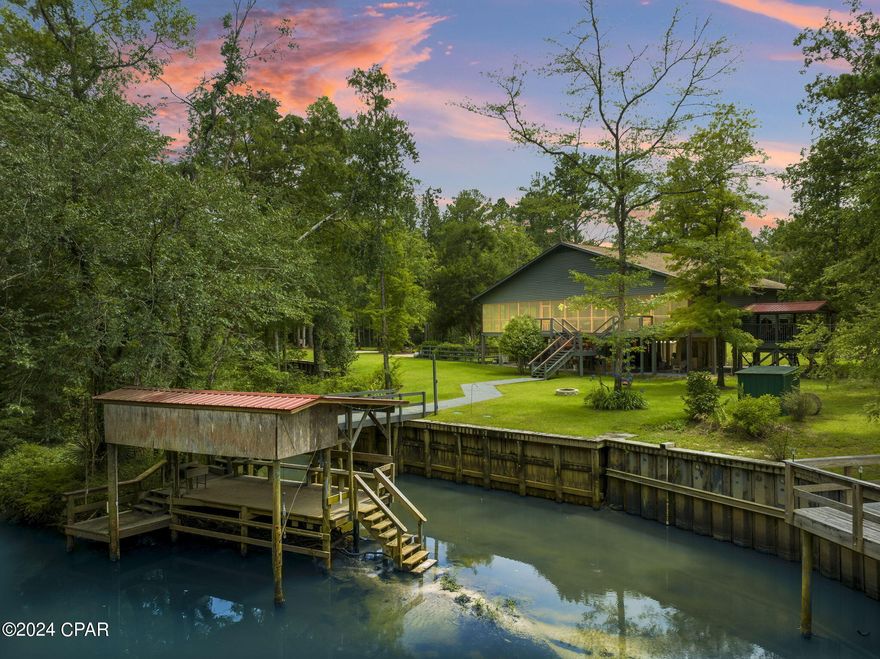 Huge PRICE ADJUSTMENT...unfortunate circumstances result in your opportunity...your chance to own 157' of Waterfront on Holmes Creek. Welcome to Rivers Edge....your new Primary home, Investment Property, Getaway from the hustle, Event Estate, Bed and Breakfast, AIRBNB...The possibilities are unparalleled. Rivers Edge consist of 7 acres of beauty including a completely remodeled and updated 3/3 w/68 foot screened porch overlooking the creek and covered boat dock w/lift. No detail was left out. Don't wait to see this one....