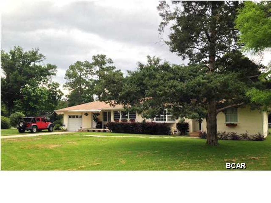 You will appreciate this ADORABLE Lynn Haven home in a quiet location! The house is on a corner lot with 0.51 acres, it has 3 bedrooms, 2 baths, Living room with a beautiful electric fireplace, dining area and spacious family room. All bedrooms have built in closets and all original wood floors throughout the house. Brand new electric water heater just installed (2015). There's a large deck for the family BBQ with a view to the fenced in backyard, so kids and puppies can run free, plus a 24x30 workshop with garage doors. The house has 1 attached garage and a covered front porch off the family room. Call your REALTOR today and schedule a showing! Age, Square Footage, and room sizes approx, if important please verify.