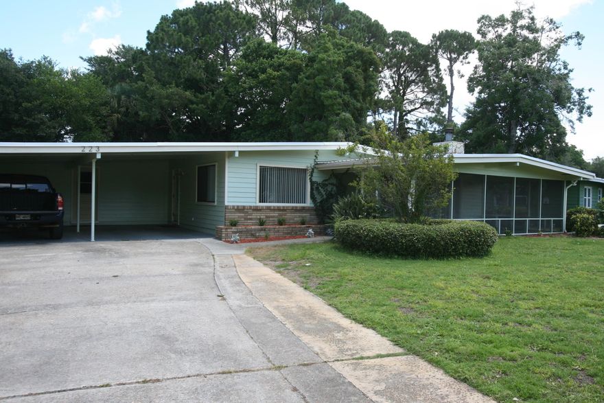 Sellers will give buyer a $5,000 credit at closing to help with closing costs!!!  Don't let the age fool you, this gorgeous home has been substantially remodeled with $70k, in improvements including a/c (2014), Galv-Aluminum 50-yr roof (2013), laminate wood floors, hickory kitchen cabinets with granite and stainless steel appliances, china cabinet and recent carpet in the remainder of the home. It has a gas fireplace with glazed stone, a 13x26 screened front porch and a 21x24 carport and 12x24 utility room with room for washer & dryer, built-in cabinets, a wash-up sink and lots of storage space. Master bedroom features two separate closets.  The yard includes two wells for irrigation and a huge storage shed.  (Click for more.) This exceptional  home has a water view, across from a canal that goes into St. Andrew's Bay and the owner states the lot is high enough that it has not had any storm surge since Hurricane Frederick in 1979 (it has been in his family that long.)   This home has redwood siding and has over 2,600 feet under roof and is truly a must see! All data and measurements are believe accurate but not warranted, please verify if important to you.