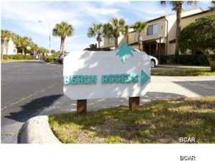 Lowest priced condo in Beachwalk, motivated seller, bring offer! Are you looking for a super affordable, fully furnished, beach condo within walking distance of the Gulf of Mexico? Then consider this condo in the heart of the quiet west end of Panama City Beach. This condo is located across the street from the pool where you can enjoy summer swims and a short stroll to the beach. This two bedroom, two bath, fully-furnished condo boasts over 1200 square feet and provides a potential buyer ample space for entertaining. The back porch of this condo is a quiet sanctuary where one can enjoy the peaceful serenity of this wonderful community, and the occasional crash of the ocean waves invigorates the senses. If that isn't enough, then consider the private balcony off of the master bedroom