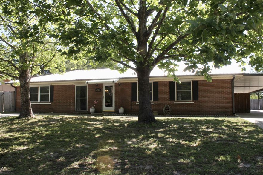 Large Corner Lot!! Lovely brick 3 bedroom, 2 bath home located in the popular Forest Park Neighborhood. Covered parking, large fenced backyard and double screened in back porch. Low maintenance metal roof installed in 2013. Many upgrades throughout the last few years, appliances, tile flooring, updated bathrooms, screened in porches, covered parking, privacy and fence lawn pump. All room sizes are approximate please verify if important.