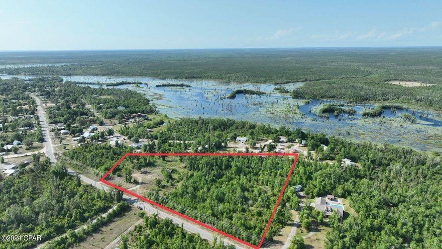 Seller will consider dividing property.

Here is your chance to own approximately 9 Acres in Youngstown, FL. Whether you're looking for a conveniently located future home site with some acreage or a builder/developer looking to take advantage of the R2 Zoning look no further. Priced to sell and ready for you to make it your own. This beautiful property features both open areas, wooded areas and a small creek/pond. There are two structures on property that hold minimal value. Take advantage of this rare opportunity today!

PID: 05287-000-000 (Approximately 1 Acre.) is also listed for sale, seller is willing to package both parcels together. 

Call a Realtor today to schedule your private tour.
If important please verify all information.