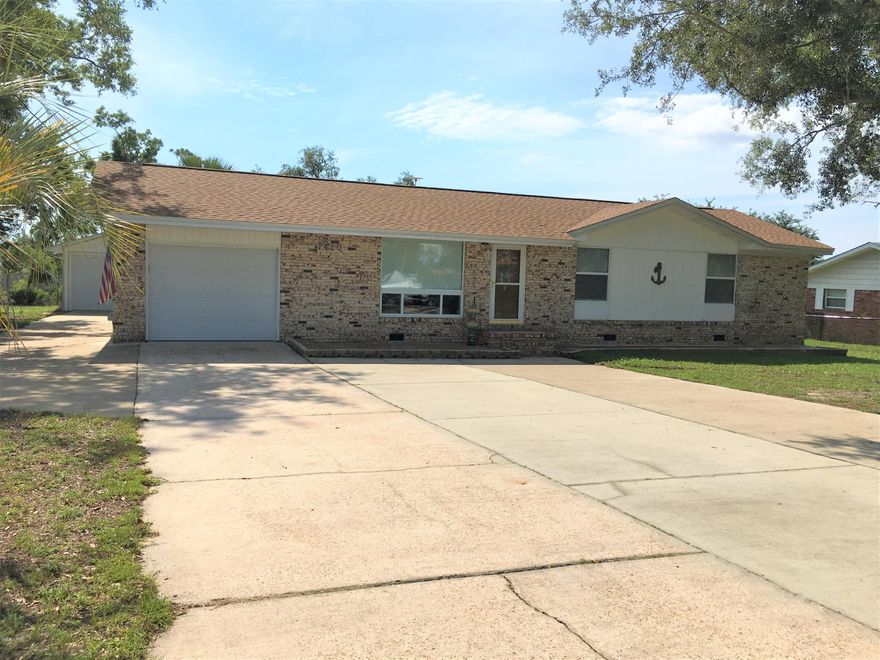 **Gulf Access**

This beautiful home sits on almost a half acre on Fanning Bayou and is located on a quiet dead end street. Enjoy your morning coffee sitting on the dock or in the Florida room overlooking the bayou. The kitchen has quartz counter tops, subway tile back splash, large pantry and an island. Master bedroom over looks the bayou through double windows and the master bath has a tile shower with a sliding glass shower door. It has a  20x16 detached garage with electric and an a/c unit with heat.  Parking for 6+ w/ 30 amp plug & septic dump for RV. TV's in the home are included.  Home is on county water, has a well & water softener.  Don't wait, come and see it today!