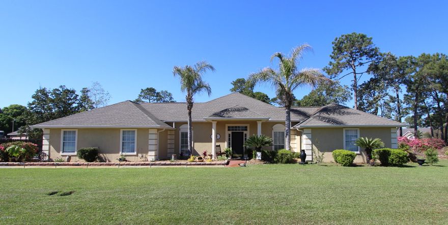 112 Shadow Bay Dr is a lovely home with lots of room for entertaining or relaxing both inside and out. Located on over an acre lot, this home features an open floor plan with extensive living room with raised ceiling, fireplace with built-ins and a wet bar. The adjoining dining room has a wall of windows and French doors that lead out to the patio. The kitchen is well appointed and has a large pantry and plenty of cabinet/counter space. There's a breakfast room with it's own patio access as well. The master suite is impressive with a double door entrance , transom over the door, raised ceilings, walk-in closet and French doors out to it's own deck. The master bath has double sinks, another massive walk-in closet, jacuzzi tub, tiled shower with glass doors and a powder room. The secondary bedrooms and bath are split and allow for lots of privacy.  The backyard is an oasis and features a deck with pergola that's perfect for relaxing in a hammock and there's a covered gazebo with pavers that is ideal for dining or relaxing with friends and family.  The roof was installed in 2015, hand scrapped wood floors install in Oct 2017, screen front door installed in 2017 (has glass inserts),   there's a spacious laundry room with sink and extra storage, a separate 8 X 6 storage/craft/bonus roof off the garage that's heated/cooled, speakers in the LR/master bath, crown molding, oversized garage, irrigation system and lots of areas to display you treasures in this elegant home.  Conveniently located close to PC Beach, Pier Park, Gayle's Trails, restaurants & attractions and easy access to Back Beach Road with the new exit onto Nautilus St. Please call to set up a showing today.  Age, SF & room sizes are approx - please verify if important.