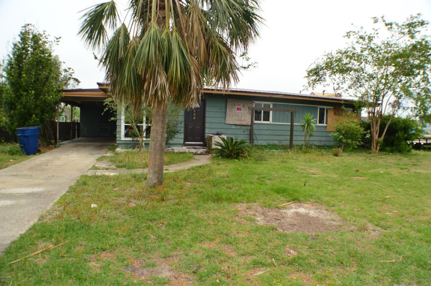 SELLER IS MOTIVATED!  New Metal Roof!  Forest Park home w/lots of potential!  This is a 4BR/2BA home that lost a few trees & some fencing in the hurricane, but the home is intact & habitable, just needs a bit of updating.  The floors are all tiled, there is a jacuzzi tub in the master bath along with a walk-in shower.  The home is all-electric & has extra storage off the carport.  Back yard is fenced & there is a large deck w/built-in bar area & an enclosed bath area with commode and sink.  Some upgrades & elbow grease will make this home look brand new!  The neighborhood is quiet & you're just minutes from shopping, dining, schools, parks & more!  Being sold AS-IS!  All info is approx. & must be verified by Buyers if important.