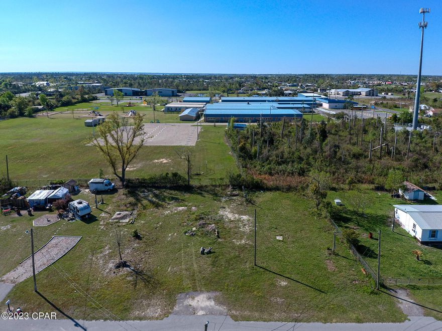 Cleared double lot centrally located close to schools, Tyndall AFB, shopping, restaurants and water. Double lot had 2 mobile homes that were removed after hurricane Michael. 2 power poles, remains of a deep well and 2 septic tanks remain condition unknown. Mobile home to right has city water. Lot is zoned for duplexes, mobile homes and single family homes. Lot is on a paved dead end road with little traffic. Drive by and check it out or call your favorite Realtor®.