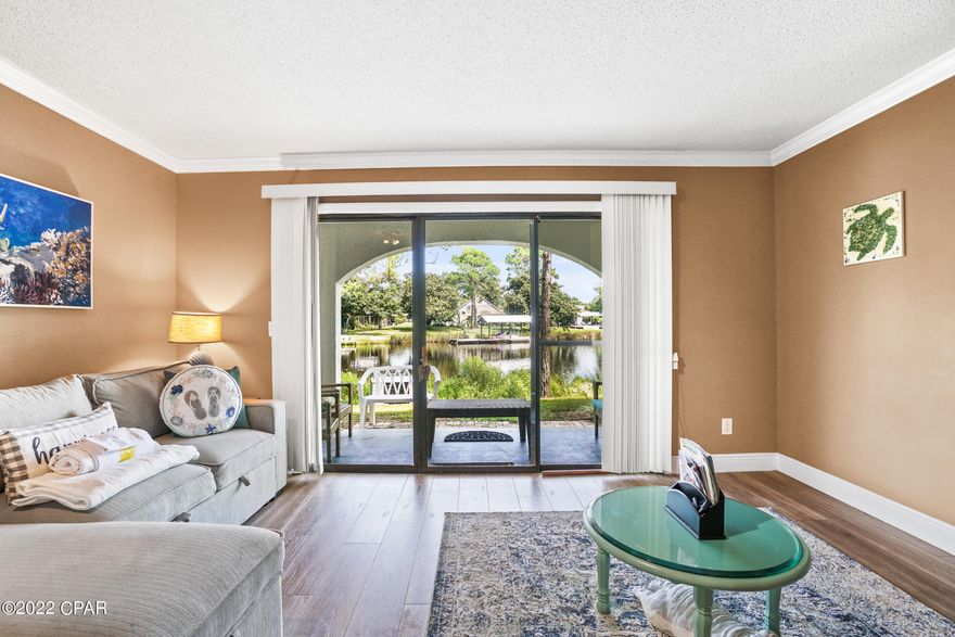 Beautifully decorated 1 bedroom / 1.5 bath condo at Villas of St. Thomas. Unit features new furniture, updated vinyl plank flooring throughout living area & bedroom and an updated kitchen. Villas of St. Thomas is a gated waterfront community located on the Grand Lagoon.  Amenities include:  Pool, Sauna, Tennis Courts, Boat Dock, Shops & Restaurants.  A public beach access point is just a short stroll away.