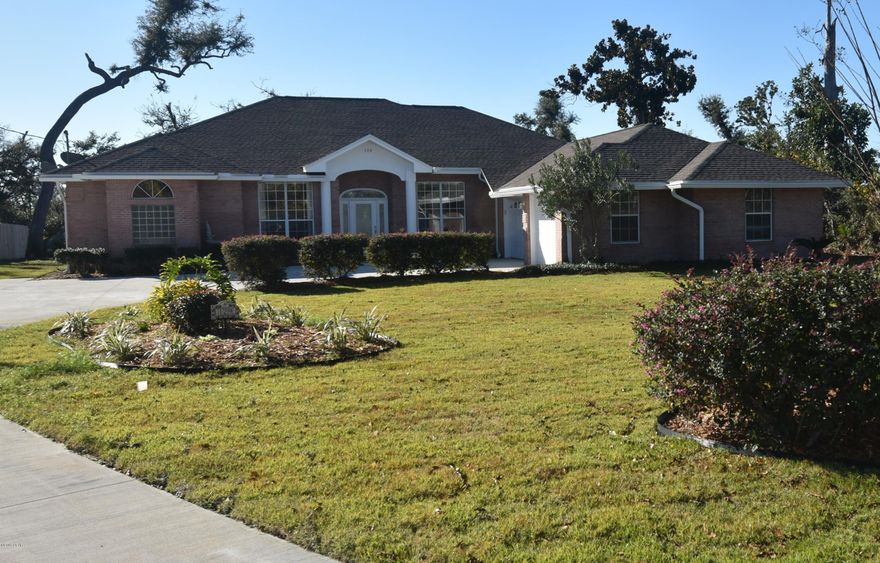 Prepare to be pleasantly surprised! You've found solitude within minutes of Tyndall AFB, Lynn Haven, and Panama City's beautiful beaches. This custom built home has a full slate of great qualities and features. This 4/2 with office featuring built in desk and bookshelves is approx 2,440 SF.  

 Recently repaired and renovated for you, this lovely home is move-in ready. 

From the moment you enter the foyer , you are welcomed into the warm and spacious living area accented by a grand lake view . The warmth of the corner gas-log fireplace will take away the chill on these cool winter nights. 

 Kitchen has been updated with new quartz counter-tops and new stainless appliances. NEW HVAC JAN 2020 The carpet is new in all bedrooms. Tile and wood floors cover the main living areas, kitchen, and baths.  Large inside laundry room next to three-car garage. This home features elegant living and dining rooms, and a master suite to die for. Enjoy the quiet, relaxed life you desire in this lakefront home featuring panoramic lake, and bay views from your screened porch or your lakeside deck and private dock.
 This home will pamper you in too many ways to describe here. Please call today for a private showing.
