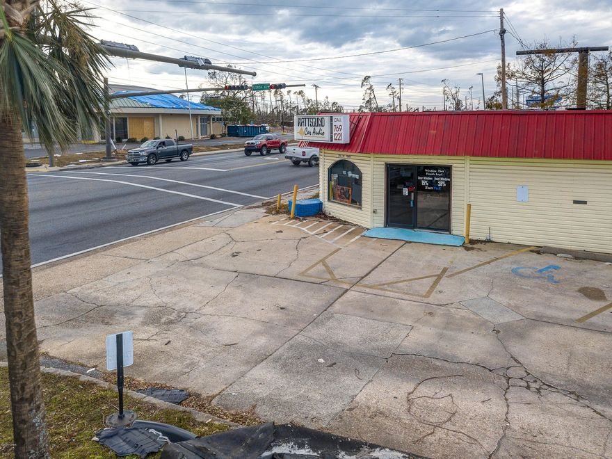 Previously the location for AutoFx for almost 20 years, now rented out for an International store. This building could be used for many uses and still has 3 car bays, counter space, retail space, office room, and vehicles can pull around in a drive thru fashion. The land is 1/4 of an acre at a busy intersection in Panama City, Fl directly on US-98, also known as 15th St and Florida Ave at the stop light. Renovation was done after Hurricane Michael. Temporary Eminent Domain will take place for a short time for the US98 project.
 Eminent domain in future is expected for a portion of the road.