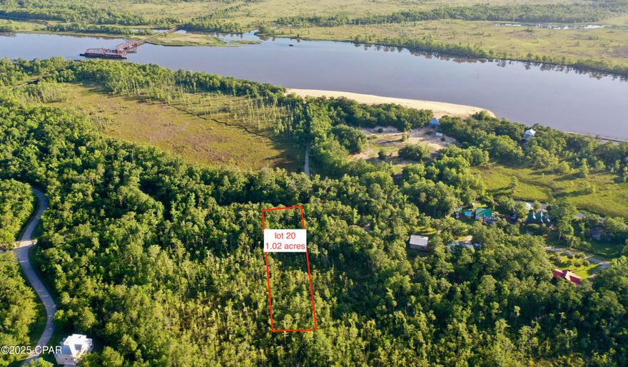 Discover your private sanctuary at Rivers Edge.  Nestled on over an acre of pristine Florida wilderness, lot 20 offers the perfect canvas for your dream home in one of Apalachicola's most coveted gated communities.  This exceptional building parcel provides the rare combination of privacy and convenience, with the sand beaches of the Apalachicola River just steps away.
River's Edge isn't just a subdivision - it's a thoughtfully planned retreat where nature takes center stage. With only 50 homesites, carefully positioned across 90 acres, and an impressive 69 acres permanently preserved in conservation easement, your investment guarantees unobstructed views of Florida's natural beauty for generations to come. What makes this special: Spacious 1+ acre lots ensuring complete privacy. Minimum single-story home-not less than 1500 sq. ft. of heated/cooled area.  Multistory home- not less than 1800 sq. ft. heated/cooled area. One mile from area boat launch, close to Apalachicola, restaurants and unique shops.