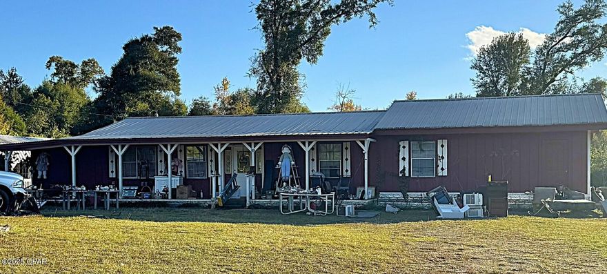 Oh, the potential of this 3.4 acres, structurally sound home and several outbuildings. It will require some renovation, however, this three-bedroom, two-bath residence could be a phenomenal home. It features an additional bonus room plus a very large laundry room. The large yard includes a 11x20 red shed that has a sink (could become a mini kitchen) and a loft. The 40x15 blue shed contains a 1/2 bath, also there is an additional 12x20 shed. The potential is endless!!! Come and view the property to see what your vision can bring.