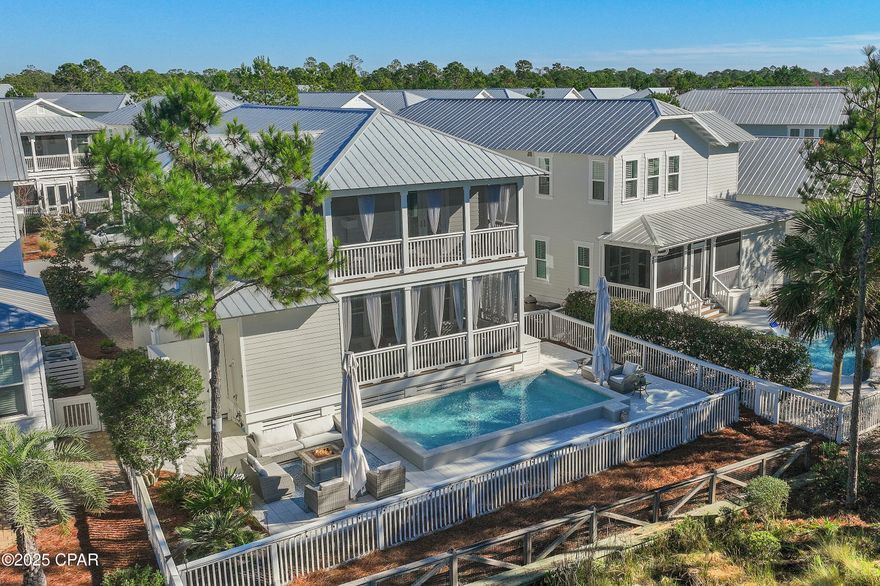 Positioned within the highly sought after NatureWalk at Seagrove community, this beautifully maintained two-story Florida cottage stands out as a truly exceptional coastal retreat. Designed for elevated outdoor living, the home's private backyard oasis showcases a temperature-controlled saltwater pool, commercial grade shade umbrellas, and a cozy fire pit, creating an idyllic setting for relaxation or entertaining in effortless style. The area adjacent to the pool provides a versatile space ideal for games and recreation. Projected to generate $133K annually, this residence offers a compelling opportunity for discerning buyers seeking a luxurious second home or a high performing vacation rental. Peacefully situated with serene pond views and backing directly onto the Point Washington State Forest, the property enjoys unrivaled privacy and immediate access to more 15,000 acres of preserved nature trails ideal for hiking, biking, and exploring. Spanning 2,556 square feet, the popular Sea Glass floor plan features rich wood flooring throughout and a welcoming fireplace in the main living area, fostering a warm yet sophisticated ambiance. The professionally curated interiors embody the essence of the Emerald Coast, blending refined coastal details across four bedrooms, four bathrooms, and expansive open concept living spaces. Every room has been intentionally designed to balance everyday comfort with timeless elegance. At the heart of the home, the chef's kitchen impresses with stainless steel appliances, including custom installed 33-inch professional refrigerator and freezer units, a gas cooktop, white shaker cabinetry, sleek granite countertops, and a grand 10-foot island perfect for hosting family and friends. The primary suite offers a tranquil private escape complete with its own covered porch, ideal for a quiet morning coffee or peaceful evening unwind. Its spa inspired en-suite bath features a soaking tub, separate walk-in shower, and elevated finishes that evoke relaxation and rejuvenation. The garage provides ample space for vehicles, a golf cart, and all your beachside gear.

NatureWalk at Seagrove offers an exceptional lifestyle with premier amenities, including a community trail to the beach less than a mile away and The Gathering Place an amenity hub with a playground, heated lap pool, zero entry pool, hot tub, fire pit, grills, TV, and bar area. Additional community highlights include fitness stations, multi-purpose courts, pickleball, and miles of scenic nature trails. Whether envisioned as a personal coastal sanctuary or a standout vacation rental, this remarkable property delivers a rare blend of luxury, functionality, and investment potential within one of Seagrove's most coveted communities