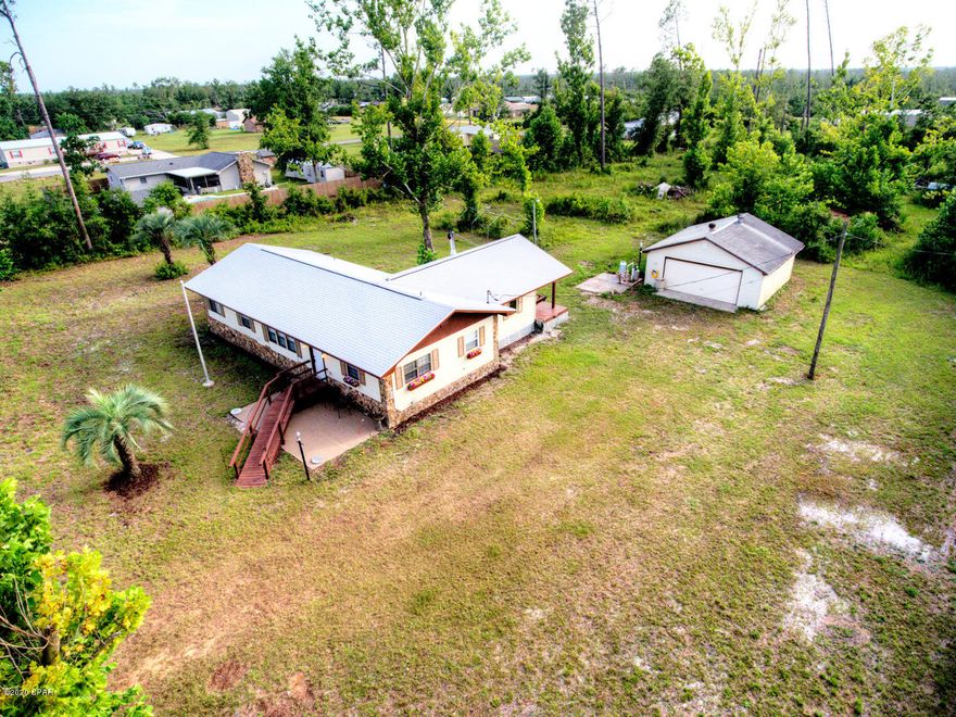 Imagine yourself swinging on the porch on the back yard watching the beautiful sunsets of Bay County while over looking your nearly 2 acre lot! This is the perfect starter home with nearly 2 acres of privacy and your own detached garage with plumbing and electrical. Home has split floor plan with double master suites.



Electrical has been updated and new panel installed some time in 1995-2005 timeline, according to home inspector. New roof installed in 2019. Wood burning fireplace in back den that could easily be a 3rd bedroom by adding closet door to the already present frame.



Washer and Dryer are in closet off of covered back patio. Home on well with septic that operate flawlessly. Home has deep water well for high quality water to the whole home.



This home will not last!