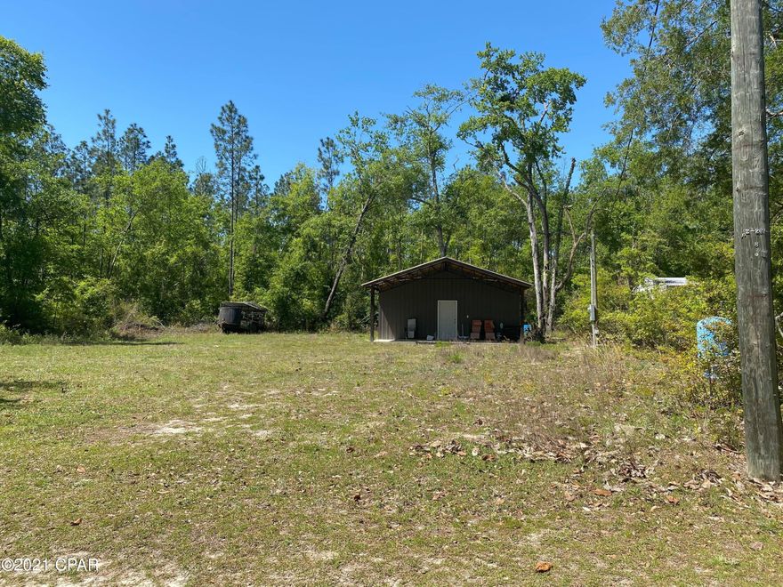Located in close proximity to the Apalachicola State Forest, 5 miles to Camel Lake, 7 miles to the Estiffanulga landing for the Apalachicola River, and 10 minutes to the landing at River Sticks, this enclosed studio apartment pole barn is the perfect place to spend the weekends unwinding and relaxing in the country! Building is about 360 SQ FT enclosed and has a septic tank, well, and electricity. It is set up like a studio with a bedroom/livingroom/kitchen and enclosed bathroom.  Bring your camper and some friends and hook it up to the additional water/power/septic hookup on the property as well, specifically for a RV/camper. Plenty of room to build a home, and the lot is cleared so move right in. Located in the small community of Orange, this spot is a boater's or sportsman's ideal setup All measurements are approximate and should be verified by the buyer. TV, AC unit inside not attached, and Grill not included in sale.