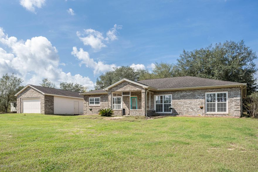 Move-In Ready Over 2000 sq feet, all brick 4 bedroom 2 bath home on 2.5 acres of land. This home features an open floor plan with vaulted ceilings, solid wood cabinets and stainless steel appliances in the kitchen, a breakfast area, Dining room & huge 16x20 living room! The Master Suite is large with an attached bonus room that would make the perfect office, exercise room, hobby room or nursery. The custom master bathroom offers a large tub and a separate large walk-in shower. The detached garage is 23'x21' and there is also a large 21'x14' building that would make a perfect workshop or storage building. There is an additional power pole, well and septic tank at the back of the property that could be used for a motorhome or mother-in-law home. Make your Appointment to vie this great home TODAY! *All measurements Approximate please measure needed*