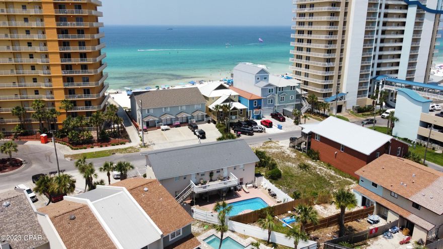 ***Multiple offers.  Highest and best due by 5pm July 6*** Short term quadplex located across the street from the beach and public access.  This multifamily complex has a pool and NO HOA.  Each of the four units features 2 bedrooms and 2 full baths.  Turn key rental machine.  Construction is all brick with 2 layers of elastomeric stucco and elastomeric paint.  Roof is 2019 and metal composite shingle.  All water heaters replaced in 2021.  Windows and doors were replaced under current ownership.  Floors have all been updated to LVP with thicker rubber backing.  Parking lot features 10 spots, 2 per unit, and two extra for vendors or overflow.  Property is very low maintenance having no grass or need for lawn service.  Financials available upon request.  This is the opportunity to own your own condo complex and avoid rising HOA fees and assessments.