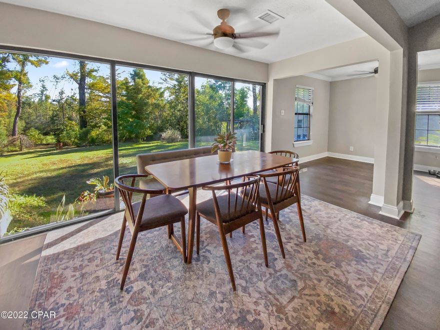 Ready for some quiet waterfront living? Ready for a home that doesn't look like all the others? Ready to have privacy and space to run in the yard? This is the home for you. This updated, quaint craftsman sits on almost a half and is not like anything else around it. Sitting anywhere in the living room, dining room, or kitchen, you'll enjoy the open views of the plush backyard and the creek while enjoying the peace and serenity of the area.  The spacious kitchen has a new refrigerator, new microwave, and beautiful newer cabinets with quartz countertops. New vinyl plank flooring compliments the craftsman look of the home. Updated bathrooms add a splash of modern to the look. The master bedroom is actually two rooms connected, so This home has much larger additional bedrooms than most newer built homes, giving ample space to put all your belongings. One thing the current owner appreciates is how well the space is utilized in the home, nothing wasted. A huge plus is the waterfront that is navigable to the bay. There is a bridge to pass under for clearance to the bay. The icing on the cake is the awesome oak tree in the front yard that completes the picture for this home and the producing fruit trees in the backyard, including bananas! Trees are hard to find these days. Don't miss out on this home, the uniqueness and location are hard to find!