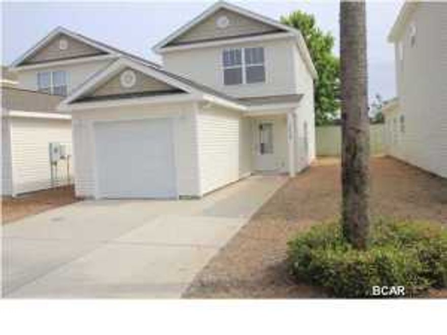 Are you a first-time homebuyer and need a low maintenance property? Or are you looking for a vacation property, but don't want to deal with high traffic and high rises? Well, this townhouse in Sterling Cove is ideal for either scenario. Sterling Cove is a gated community and is in close proximity to several shopping plazas, grocery stores, restaurants, and The Naval Base. Just a short 5 minute drive away from the beach is all that separates you from the breathtaking sunset views and sugary white sands of the Worlds Most Beautiful Beaches here in Panama City Beach. This 2 bedroom 1.5 bathroom townhome has a single car garage and an outdoor covered patio area. The spacious first floor contains the large kitchen and living room as well as a half bath. The upper level features both