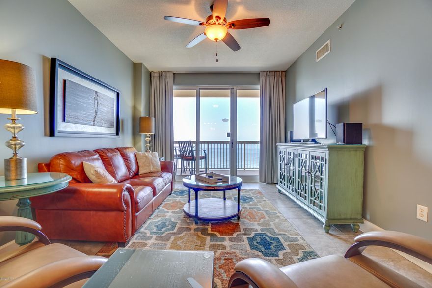 BEST OF THE BEST IN SUNRISE BEACH! Sunrise Beach unit 2309 is the beach getaway that you have been dreaming of! Super-efficient floorplan, this oversized 2 bedroom + bunkroom, 2 bath gulf front condo lives like a true 3 bedroom and sleeps 8! It also has a PRIME upper floor location in the deluxe 25-story Gulf front complex, offering huge east to west Gulf views from the kitchen, dining, and living area! This ultra clean, meticulously maintained, turnkey offering offers all of the extras and is tiled throughout, professionally remodeled and decorated, and will convey fully furnished and rental ready. Ceramic tile throughout makes for super low maintenance. Interior features include a spacious and open floor plan with raised ceilings. The gourmet kitchen is fully equipped. Recent appointments include a new refrigerator, custom shaker style cabinets, and tile backsplash. Master bedroom is Gulf front with balcony access. On-suite master bathroom is large enough to accommodate two closets and features custom double vanity and custom walk in shower with amazing and unique frameless shower doors. Guest bed room and bonus bunk room are larger than most. Bunk room features a pop-up trundle. Guest bath also has a custom vanity that matches the master offering continuity of finished through the property. Sunshine and warm gulf breezes abound from the large balcony which is accessed through large glass sliders from both the living area and master bedroom. Enjoy sunrise views in the morning and sunset views in the evening - the ultimate in alfresco living! Property is in immaculate condition and absolutely turnkey - great for second home, vacation rental or full time living. There is plenty of storage throughout this unit with the ample closets and oversized laundry area complete with full sized washer and dryer. An exterior storage closet also conveys with the sale which is great for catching beach chairs etc. and keeping sand out of the condo. EXCELLENT RENTAL INCOME POTENTIAL. Seller has installed a continuous drain Dehumidifier and 2016 newly installed HVAC has been fitted with the revolutionary Coastal Green Air energy conservation system which allows for advanced management of utility usage to reduce costs and increase your bottom line. Less than a mile from Pier Park, the Sunrise Beach development is centrally located to all the dining and entertainment PCB is famous for including spas, shopping, golf, fishing and more! In addition to over 330ft. of beautiful white sandy beachfront, Sunrise Beach has an amazing amenities package to include: 2 elevated Gulf front pools (one heated seasonally) 2 hot tubs, large sun deck, spray park, owners lounge with full kitchen, 2000sqft Gulf front exercise room, theatre, Gulf front gas grills, & plenty of underground parking allowing for access to the condo without exposure to the elements! SUNRISE BEACH IS OWNER CONTROLLED which means the homeowners own the gym, the pools, and receive the income from the Beach Chairs, etc.