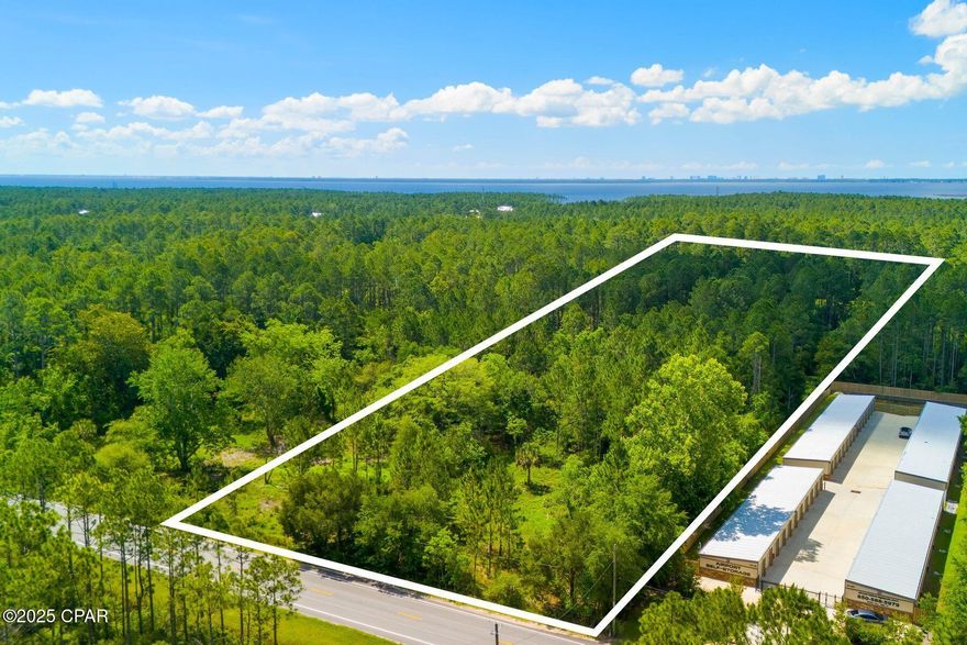 Discover an incredible opportunity with this 8-acre property located in one of the most rapidly growing areas of Panama City Beach. Zoned WBC (West Bay Center) within the West Bay Sector Plan, this property offers exceptional flexibility for a wide range of development possibilities. At the rear of the property lies a picturesque pond, an ideal focal point for a future community amenity or serene natural retreat. Strategically positioned, this property is just two miles from the bustling Northwest Florida Beaches International Airport and one mile from thriving Latitude Margaritaville Watersound, a vibrant 55+ community poised for significant expansion. Its proximity to the newly established Tallahassee Memorial Healthcare Hospital and a growing commercial hub enhances its appeal. Adjacent to the upscale RiverCamps on Crooked Creek, the property benefits from a tranquil and desirable neighboring community. Utilities, including water and sewer, are conveniently located nearby, providing the essential infrastructure and flexibility for a visionary development. Whether you're envisioning a residential enclave or exploring the possibilities of commercial ventures, this prime acreage combines natural beauty, a strategic location and limitless potential to bring your vision to life.