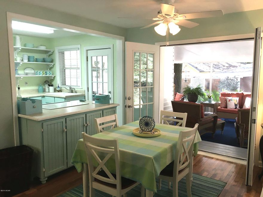 4 bedroom 2 bath on gorgeous 1/3+ acre corner lot in the COVE is a unique find. Sturdy all-brick home is the essence of Florida living, with interior inspired by Coastal Living magazine. The hardwood floors are beautifully refinished, numerous windows let the light flow in, with unique handcrafted details. French doors lead you to a screened-in 15 x 25 ft. deck accommodates crowds nicely! This home will save you dollars on insurance with new roof in 2012, roof clips added for wind protection, and in flood zone X, the best rated! Come see today!