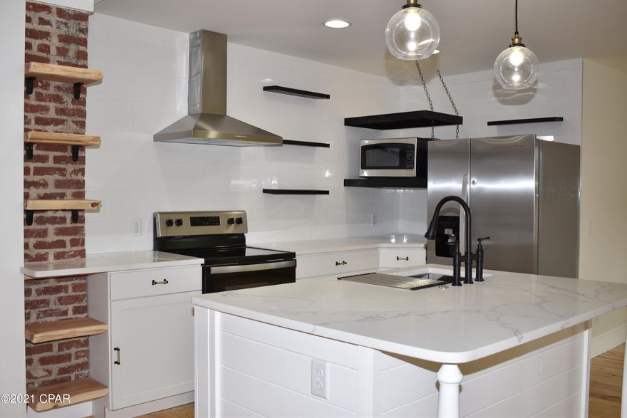 Remodeled from the studs out!  All new EVERYTHING from ceiling to floors in this beautiful custom Cove home! New roof, all new plumbing inside & out, new electrical wiring, new HVAC and more.  You will be immediately drawn into the open floor plan in the combined living, dining and Kitchen areas the second you walk through the door!  This home features 5 bedrooms PLUS a bonus office space.  Yard is spacious and features pavers and a HUGE shed!  Alley Access and a dbl gate will make it easy to get your boat or camper into the back yard.  Excellent School -Cherry St elementary just a short walk away, and the Bay is so close you can smell the salt air!  This exquisite property will sell fast!!