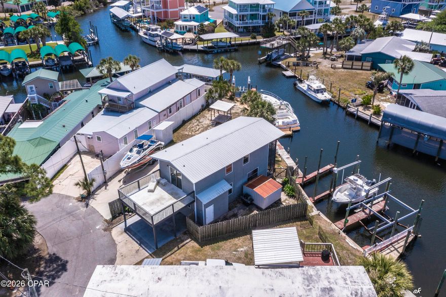 Welcome to 929 Marina Drive!  Waterfront like this is a boaters dream and hard to find on Panama City Beach. Located at 929 Marina Drive, this 3-bedroom property sits on deep water with two private boat slips, giving you direct, reliable access whenever you want to be on the water. Whether it's early morning fishing runs, sunset cruises, or pulling up after a day at Shell Island, this is built for true boat living--not just the idea of it. The home offers waterfront balcony views and room to expand, making it flexible for a primary residence, second home, or a high-performing short-term rental. That's where this one separates itself--short-term rentals are allowed, and very few properties offer private boat slips with that flexibility, a combination that drives strong demand and premium rental potential. You're also positioned exactly where you want to be, about 15 minutes to Pier Park for dining, shopping, and nightlife, around 10 minutes to Schooners and St. Andrews State Park for some of the best beach days on the Gulf, and with quick access into Panama City for everyday convenience. There's also a marina just one minute away with a boat ramp, making launching, storing, or hosting guests with boats simple. This is the kind of property buyers wait on--secure your boat, enjoy true waterfront living, and generate income when you're not using it.