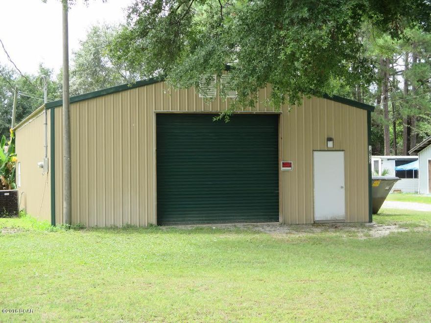 Great opportunity to have a business with an apartment in the rear of the building.  The property has 4 storage buildings and 2 mobile homes currently rented. The metal warehouse is 30 X 50 with a 20 X 30 apartment in the back complete with lots of cabinets, countertop space, large living room, separate bedroom, 1 1/2 baths and 10ft ceilings. The apartment has a propane stove, refrigerator, double sink and rents for 650.00 a month. Entire 30 X 50 building is heated and cooled. One of the 2 mobile homes is 2 bedrooms 2 baths and one is a 3 bedroom 2 bath with wood burning fireplace.  Both homes include washer dryer and refrigerator.  One home has a dishwasher. Both homes are currently rented for 850.00 a month. 4 storage buildings on property / 1 has bathroom with shower. Run a business and have income from the rental properties located on this land. Property fronts HWY 2321 and goes all the way back to Bay Crest Rd providing ingress and egress from both ends.  Ideal for automotive shop, car lot or whatever you may need. Call for your private showing today.