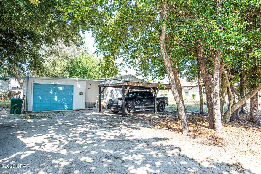 Located just moments from the sugar-white sands of the Gulf, this three-bedroom, two-bath single-wide home sits on a coveted double lot in the heart of Laguna Beachâ''one of Panama City Beach's most beloved neighborhoods. Whether you're seeking a beach retreat, a rental investment, or the perfect spot to build your dream home, this property delivers unmatched potential.

The existing residence, built in 1985, offers a practical layout with two full bathrooms, a spacious living area, and a kitchen ready for your personal touches. With ample outdoor space and mature coastal foliage, the oversized lot provides rare flexibility for future expansion, additional parking, or outdoor living enhancements.

Zoned for golf carts and tucked away in a quiet, golf-cart-friendly community with an optional HOA, this is an exceptional chance to own a slice of old Florida charm just blocks from the beach.