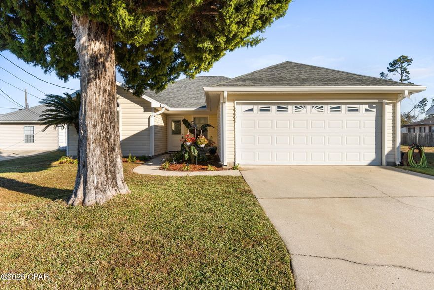 A new year, a new home! You will love this move in ready 3 bed, 2 bath home in Parker that is just a stone's throw from Tyndall AFB. Highlights include beautiful, engineered hardwood floors throughout the main living areas and carpet in the bedrooms, granite countertops in the kitchen, ornate cabinetry with pull out drawers, and stainless-steel appliances.  Additional highlights are a kitchen pantry, separate laundry room, new interior paint throughout, new sliding glass door, tray ceiling, split bedroom plan, alarm system, gutters, pull down stairs to the attic, sprinkler system in front yard, separate irrigation meter, covered patio, open paver patio and blueberry bushes, ornamental bananas and day lilies.  The roof and vinyl siding was replaced in 2018, HVAC is 2016 and water heater is 2025.  There is a nice sized yard, but it's not fenced.  Make plans to see this beautiful home today!