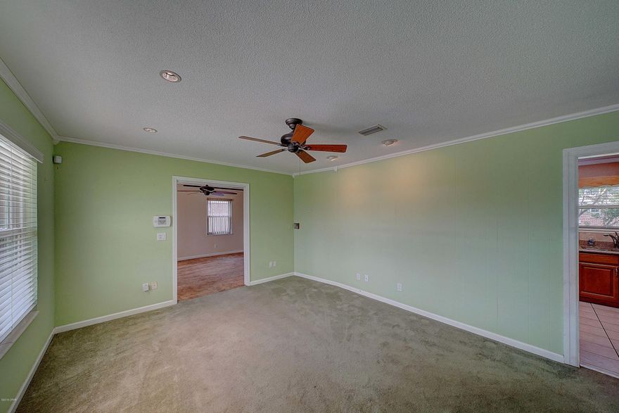 CURRENTLY UNDER CONTRACT, SELLER ACCEPTING BACKUP OFFERS This home is a survivor! and sustained no damage during hurricane Michael. It has a durable standing seam roof which was installed in 2009, HVAC units are only 4 years old and updated low-E energy efficient windows.  The kitchen with breakfast nook was tastefully remodeled a few years back and has granite counter tops, s/s appliances and solid oak cabinets, master bedroom with master bathroom, along with 2 further bedrooms and a family bathroom. There are 2 family rooms and a bonus room, so there's plenty of space for everyone to have their own space, the enclosed garage could be used as a large family room, den or by adding a door even a 4th bedroom. FYI standing seam metal roofs have no surface visible fasteners, which means they aren't exposed to UV, moisture, wind, and other elements that can cause a fastener to wear or fail over time. Also, standing seam systems don't put holes in the panels that are protecting your roof structure and has superior weather-tight qualities