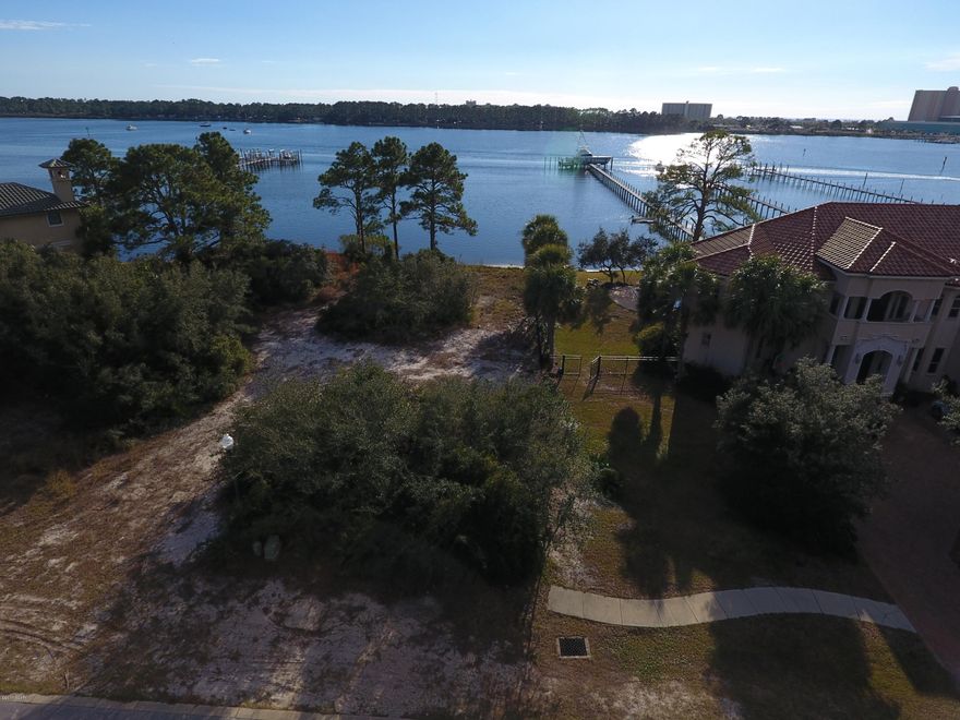 Finisterre, the premier waterfront and gated community for the most exquisite homes available in Panama City Beach. The community is privately gated with tennis courts, immaculate houses and breathtaking details. If the ''wow'' factor is what you seek, look no further. The property has 81 feet on beautiful Grand Lagoon and deep water access. Take a look at the aerial photos to see the surroundings and the size boats that are already docked in the subdivision. Come visit today!