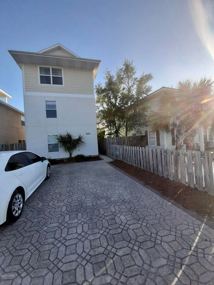 CURRENTLY UNDER CONTRACT, SELLER ACCEPTING BACKUP OFFERSResort style living only a 4 minute walk to the beach! Rick Seltzer Park is across Thomas Drive. This beautiful 3 bedroom 3 bathroom beach house is ready for rentals or full time occupancy. The first floor offers a full bedroom and full bath with laundry and living room. The second floor boasts a spacious kitchen with balcony and another full sized bed and bath. The third floor offers a master suite with balcony and fireplace and very spacious master en suite and a wet bar. Very nice patio off the first floor with wonderful views of the resort style pool. The pool is only shared by 5 homes. Hurry and