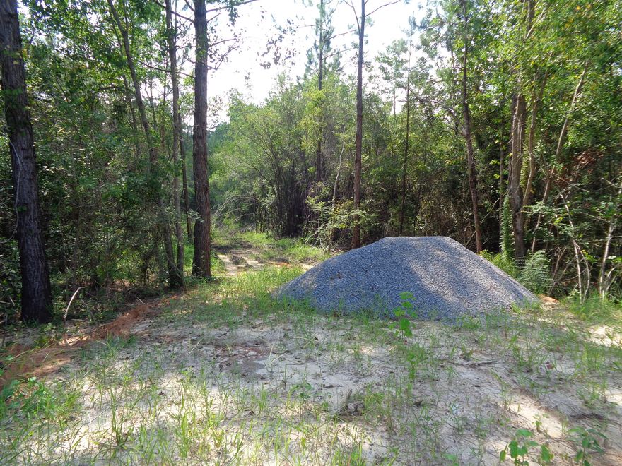 Wooded acreage located close to amenities. Seller has had property surveyed and some clearing done. The property needs a septic but City of Bonifay will  put in  water. Electric  available. Seller has had a culvert installed. Property has a prescribed Right a way for City of Bonifay.
